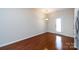The dining area shows hardwood floors, neutral walls, and an exterior door with lots of natural light at 5216 Crystal Lakes Dr, Rock Hill, SC 29732