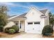 Charming home with a one-car garage, manicured bushes, and a well-maintained lawn, offering great curb appeal at 5216 Crystal Lakes Dr, Rock Hill, SC 29732