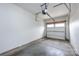 An empty two car garage with concrete flooring and automatic garage door opener at 5216 Crystal Lakes Dr, Rock Hill, SC 29732