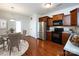 Well-lit kitchen featuring stainless steel appliances, granite countertops, and dark wood cabinets at 5216 Crystal Lakes Dr, Rock Hill, SC 29732
