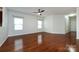 Inviting living room featuring hardwood floors, neutral walls, and two bright windows for natural light at 5216 Crystal Lakes Dr, Rock Hill, SC 29732