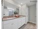 Bathroom featuring a double sink vanity with granite countertops and modern fixtures at 6265 Fairfax Ct, Maiden, NC 28650