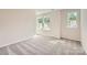 Comfortable carpeted bedroom with ample natural light from two windows at 6265 Fairfax Ct, Maiden, NC 28650
