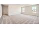 Spacious carpeted bedroom with plenty of natural light from the two windows at 6265 Fairfax Ct, Maiden, NC 28650