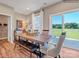 Dining area with table, chairs and bench, open to outdoor views at 6265 Fairfax Ct, Maiden, NC 28650