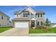 Charming two-story home featuring stone accents, a two-car garage, and a well-manicured front lawn at 6265 Fairfax Ct, Maiden, NC 28650