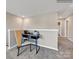Hallway with study desk, chair, and view of a bathroom at 6265 Fairfax Ct, Maiden, NC 28650