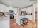 Modern kitchen with stainless steel appliances, subway tile backsplash and breakfast bar with seating at 6265 Fairfax Ct, Maiden, NC 28650