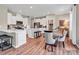 Bright, open kitchen featuring white cabinetry, stainless steel appliances, and a cozy dining nook at 6265 Fairfax Ct, Maiden, NC 28650