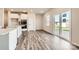 Bright eat-in kitchen features stainless appliances, a center island, and a sliding door to the yard at 6265 Fairfax Ct, Maiden, NC 28650