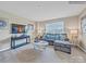 Cozy living room featuring a couch, large TV, and a coffee table at 6265 Fairfax Ct, Maiden, NC 28650