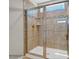 Modern tiled shower featuring glass door and neutral tones at 6265 Fairfax Ct, Maiden, NC 28650
