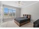 Relaxing bedroom displaying a minimalist bed frame complemented by bright natural light from a large window at 700 Creekbridge Dr, Rock Hill, SC 29732