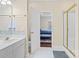 Main bathroom showing a shower, vanity, and doorway to the primary bedroom at 700 Creekbridge Dr, Rock Hill, SC 29732