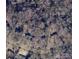 Aerial view of property showing boundaries and surrounding homes in a wooded setting near Forest Drive at 906 Forest Dr, Lancaster, SC 29720