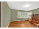 Inviting bedroom bathed in natural light with hardwood floors and classic finishes at 906 Forest Dr, Lancaster, SC 29720
