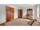 Bedroom with beautiful wood closets and dresser, ample closet space, and natural light at 906 Forest Dr, Lancaster, SC 29720