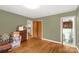 Spacious bedroom featuring wood floors, a closet, and access to a bathroom and kitchen at 906 Forest Dr, Lancaster, SC 29720
