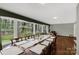 Formal dining room boasts large windows and a long table with seating at 906 Forest Dr, Lancaster, SC 29720