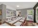 Bright dining room features hardwood floors and built-in china cabinet at 906 Forest Dr, Lancaster, SC 29720