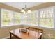 Bright dining room with ample natural light, a wooden table and comfortable seating for Gathering dinners at 906 Forest Dr, Lancaster, SC 29720