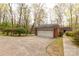 Spacious two-car garage with a wide driveway and a lush landscape, accessible to the main house at 906 Forest Dr, Lancaster, SC 29720