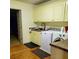 Bright laundry room with a sink, cabinets, washer, and dryer at 906 Forest Dr, Lancaster, SC 29720