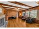 Living room features wood paneled walls, hardwood floors and fireplace at 906 Forest Dr, Lancaster, SC 29720