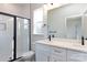 Modern bathroom boasts a glass-enclosed shower, double vanity, and sleek black fixtures at 119 Ethel Dr, Stanley, NC 28164