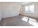 Bright bedroom with plush carpeting, a large window, and an en-suite bathroom at 119 Ethel Dr, Stanley, NC 28164