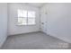 Bright bedroom with neutral walls, carpeting and a large window for ample light at 119 Ethel Dr, Stanley, NC 28164