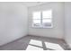 Bright bedroom features neutral walls and carpet with ample natural light from the window at 119 Ethel Dr, Stanley, NC 28164