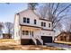 Charming two-story home featuring a bright blue front door, black garage door, and inviting front porch at 119 Ethel Dr, Stanley, NC 28164