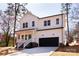 Charming two-story home featuring a bright blue front door, black garage door, and inviting front porch at 119 Ethel Dr, Stanley, NC 28164