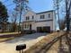 New construction featuring a two-story design with a white exterior, attached garage, and a concrete driveway at 119 Ethel Dr, Stanley, NC 28164