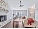 Bright living room featuring hardwood floors, a painted brick fireplace and an abundance of natural light at 13015 Greycrest Dr, Charlotte, NC 28278