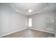 Spacious bedroom boasts trey ceiling, fan and two windows offering great light at 151 Kallie Loop, Mooresville, NC 28117