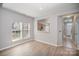Dining room with wood look flooring and natural light from the large windows at 151 Kallie Loop, Mooresville, NC 28117