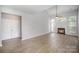 Spacious living room features wood-look floors, a ceiling fan, a vaulted ceiling, and a fireplace at 151 Kallie Loop, Mooresville, NC 28117