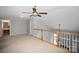 Second story loft features decorative railing overlooking the lower level at 151 Kallie Loop, Mooresville, NC 28117