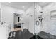 Modern bathroom connects seamlessly with a glass enclosed shower featuring black hardware and geometric tiling at 1575 Shinnville Rd, Cleveland, NC 27013