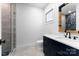 Modern bathroom featuring a sleek vanity with white countertop and a frameless glass shower at 1575 Shinnville Rd, Cleveland, NC 27013