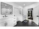 Modern bathroom featuring dual sinks, black hardware, and a glass enclosed shower with custom tiling at 1575 Shinnville Rd, Cleveland, NC 27013