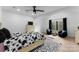 Bright bedroom with a ceiling fan, large window, and sitting area offering a relaxing retreat at 1575 Shinnville Rd, Cleveland, NC 27013