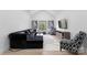 Well lit sitting area with modern furnishing, plush seating, and decoratively patterned chairs and ottoman at 1575 Shinnville Rd, Cleveland, NC 27013