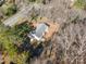 Aerial view of a charming single-Gathering home with fenced backyard and mature trees in a suburban neighborhood at 1601 South Point Rd, Belmont, NC 28012