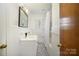 Clean bathroom featuring tiled flooring, a classic vanity, and a shower-tub combination at 1601 South Point Rd, Belmont, NC 28012