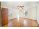 Spacious bedroom with hardwood flooring, natural light, and simple design at 1601 South Point Rd, Belmont, NC 28012