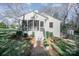 Charming home featuring a screened-in porch and brick pathway at 1601 South Point Rd, Belmont, NC 28012