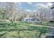 Landscaped property with a well-maintained lawn and tree coverage at 1601 South Point Rd, Belmont, NC 28012